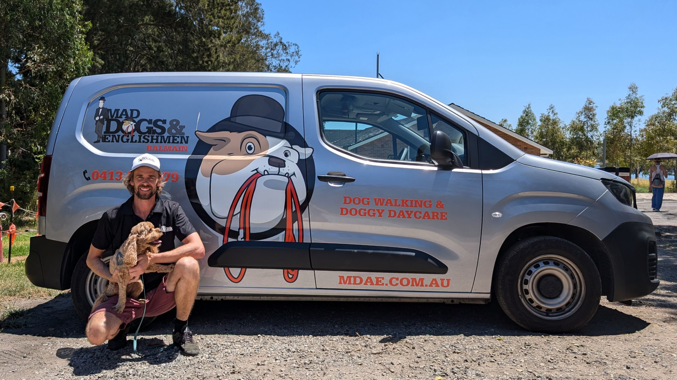 Luke sitting beside his air-conditioned van